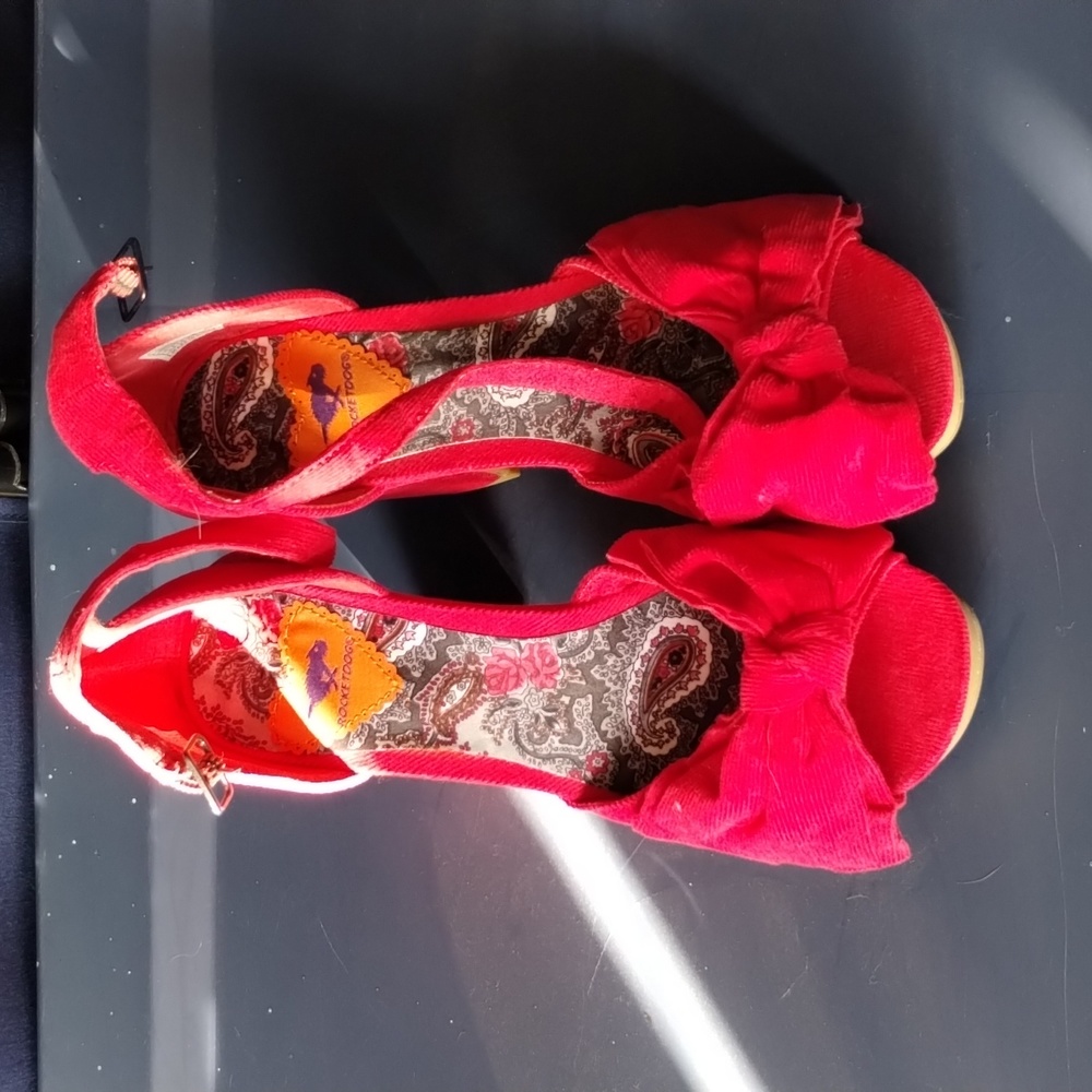 Red, corduroy, with bow platform heels.
